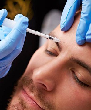 Man relaxing while receiving BOTOX injection