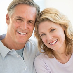 An older couple with dental implants in Jupiter smiling